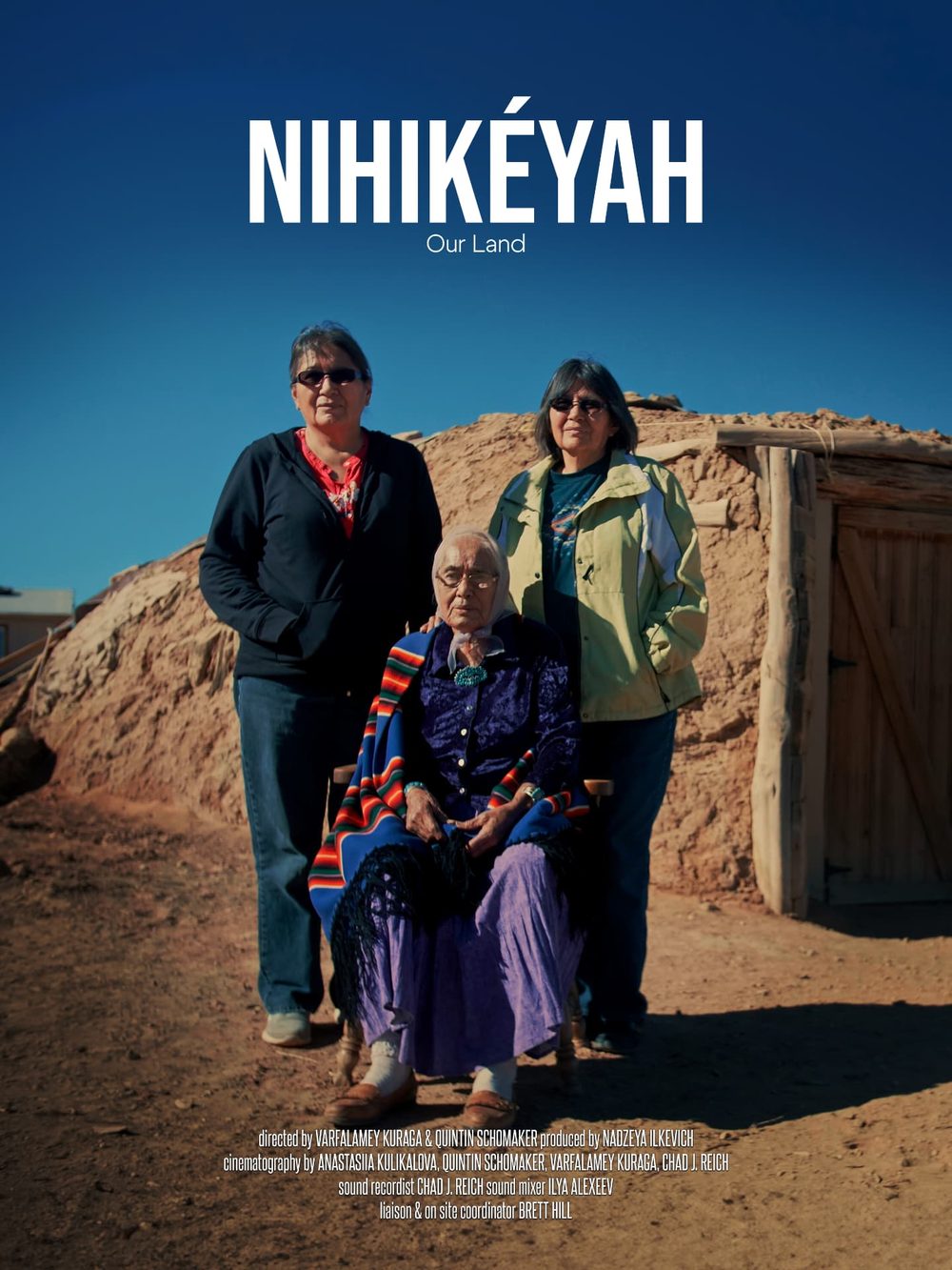 Nihikéyah (Our Land) film poster with three Navajo women outside a hogan