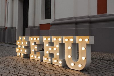 Illuminated EHU marquee letters outside the university building