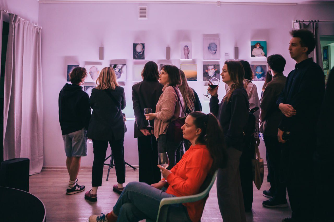 Guests at an art exhibition opening